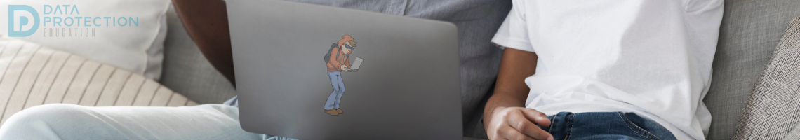 Image of a father and son sat on a sofa in front of a laptop looking surprised with their hands in the air.  Laptop has a logo of Harry the Hacker on the back.  Data Protection logo is a watermark on the top left